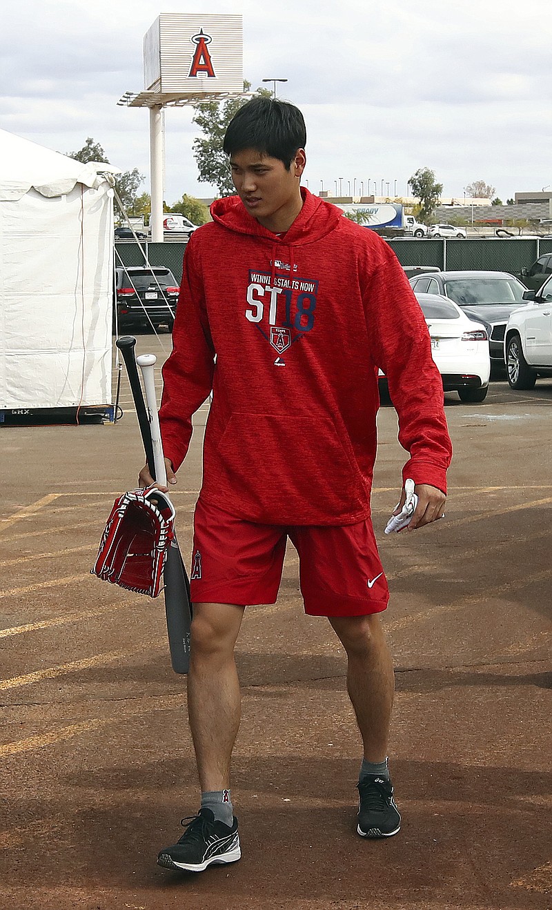 
              Los Angeles Angels' Shohei Ohtani walks from the batting cage during a spring training baseball practice on Tuesday, Feb. 13, 2018, in Tempe, Ariz. (AP Photo/Ben Margot)
            