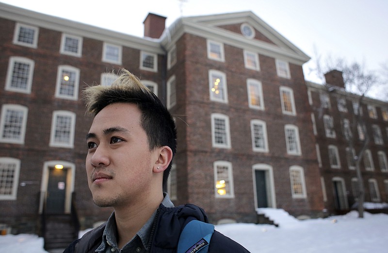 
              FILE - In this Feb. 14, 2017 file photo, Viet Nguyen poses for a portrait on the Brown University campus in Providence, R.I. Nguyen, now an alumnus, helped lead an effort urging Brown and other elite universities to rethink their legacy admissions policies. (AP Photo/Steven Senne, File)
            