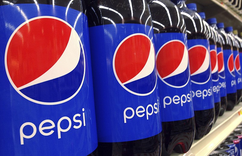 FILE - In this July 9, 2015, file photo, Pepsi bottles are on display at a supermarket in Haverhill, Mass. PepsiCo reports financial results Tuesday, Feb. 13, 2018. (AP Photo/Elise Amendola, File)