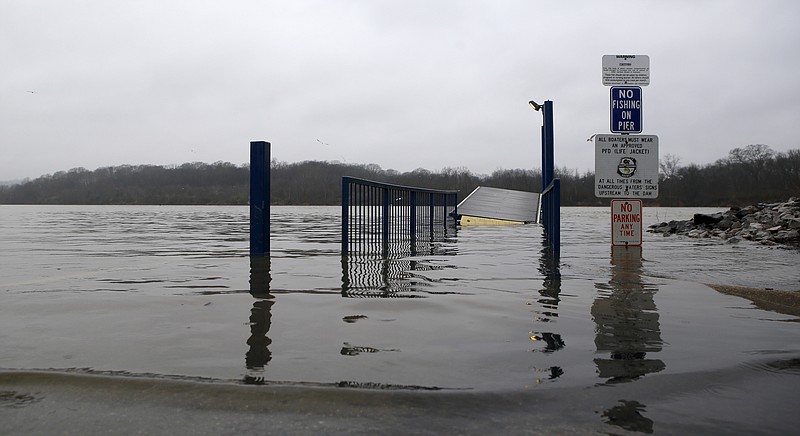 Water covers the boat ramp near the Hubert Fry Center along the Tennessee Riverpark on Wednesday, Feb. 14, 2018 in Chattanooga, Tenn. According to the Hamilton County Parks and Recreation Department all of the piers and boat ramps were closed to the public due to high waters.