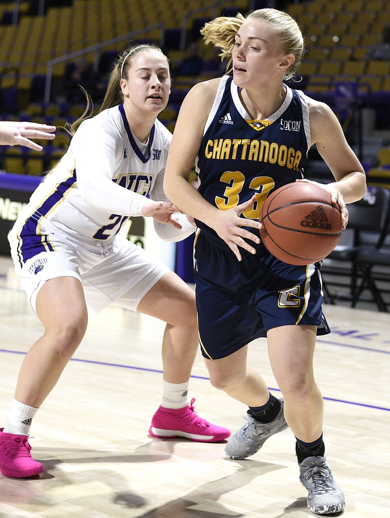 UTC's Lakelyn Bouldin (33) goes baseline past Western's Tess Harris (21).  The University of Tennessee Mocs visited the Western Carolina Catamounts in Southern Conference women's basketball action at the Ramsey Center in Cullowhee, North Carolina on February 1, 2018