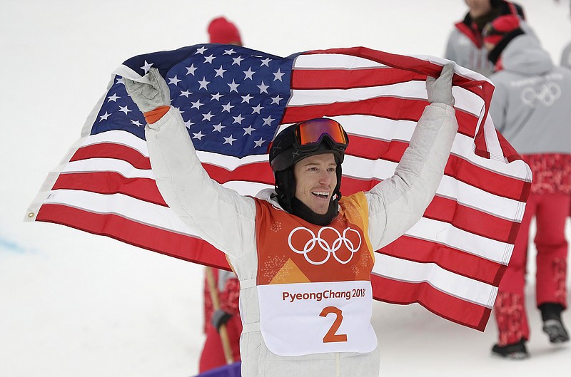 Shaun White, of the United States, celebrates winning gold after his run during the men's halfpipe finals at Phoenix Snow Park at the 2018 Winter Olympics in Pyeongchang, South Korea, Wednesday, Feb. 14, 2018. (AP Photo/Gregory Bull)