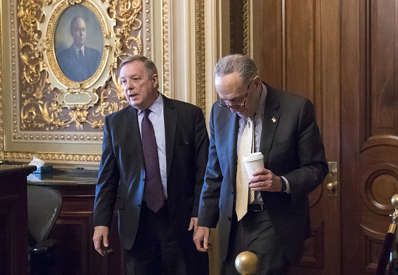 Sen. Dick Durbin, D-Ill., left, and Senate Minority Leader Chuck Schumer, D-N.Y., walk together outside the chamber during debate in the Senate on immigration, at the Capitol in Washington, Wednesday, Feb. 14, 2018. Schumer said on the Senate floor that "the one person who seems most intent on not getting a deal is President Trump." (AP Photo/J. Scott Applewhite)