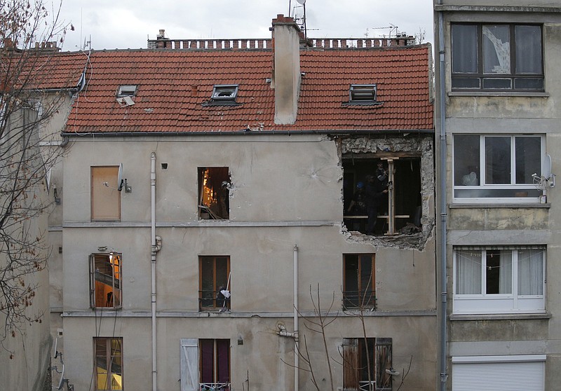 
              FILE - In this Nov.19, 2015 file photo, the building of the police raid on an apartment is pictured in Paris suburb Saint-Denis. A French court is expected to hand down Wednesday Feb.14, 2018 a verdict for a man accused of harboring killers who carried out the 2015 Paris attacks. Jawad Bendaoud, a 31-year-old street criminal, faces up to six years in prison if convicted of providing lodging to two of the attackers and helping them hide from police when they were the most-wanted criminals in France. (AP Photo/Christophe Ena, Fie)
            
