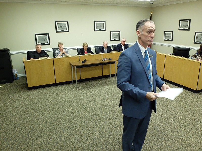 Standing in front of the Walker County School Board,  Superintendent Damon Raines speaks to an over crowded board room of more than 100 about his silence on the issue of Mike Culberson, principal of LaFayette High School. "He will return to work tomorrow," Raines said. Board members from left are, Bobby McNabb, Karen Stoker, Phyllis Hunter, Mike Carruth and Dale Wilson.