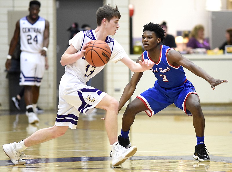 Central's Brett Abshire (13) dribbles cross court while Red Bank's Mike Porter (3) defends.  The Red Bank Lions visited the Central Purple Pounders in TSSAA boys's District 6-AA action on February 15, 2018