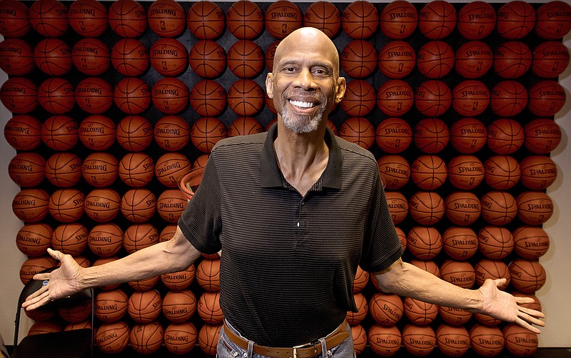 In this Monday, Feb. 12, 2018, photo, Kareem Abdul-Jabbar poses in his office, in Newport Beach, Calif. Abdul-Jabbar has been a best-selling author, civil-rights activist, actor, historian and one of the greatest basketball players who ever lived. This fall Abdul-Jabbar will embark on a cross-country tour as part of "Becoming Kareem," a stage show in which he'll discuss his life, answer audience questions and talk about the key mentors in his life he says helped him achieve his goals along the way. (AP Photo/Mark J. Terrill)