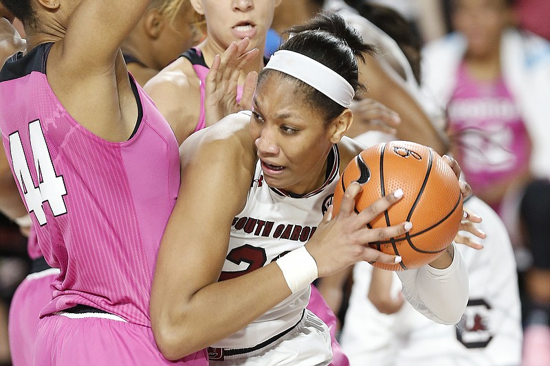 South Carolina forward A'ja Wilson (22) looks for an open pass while being defended by Georgia forward Malury Bates (44) during an NCAA college basketball game Thursday, Feb. 15, 2018, in Athens, Ga. (Joshua L. Jones/Athens Banner-Herald via AP)