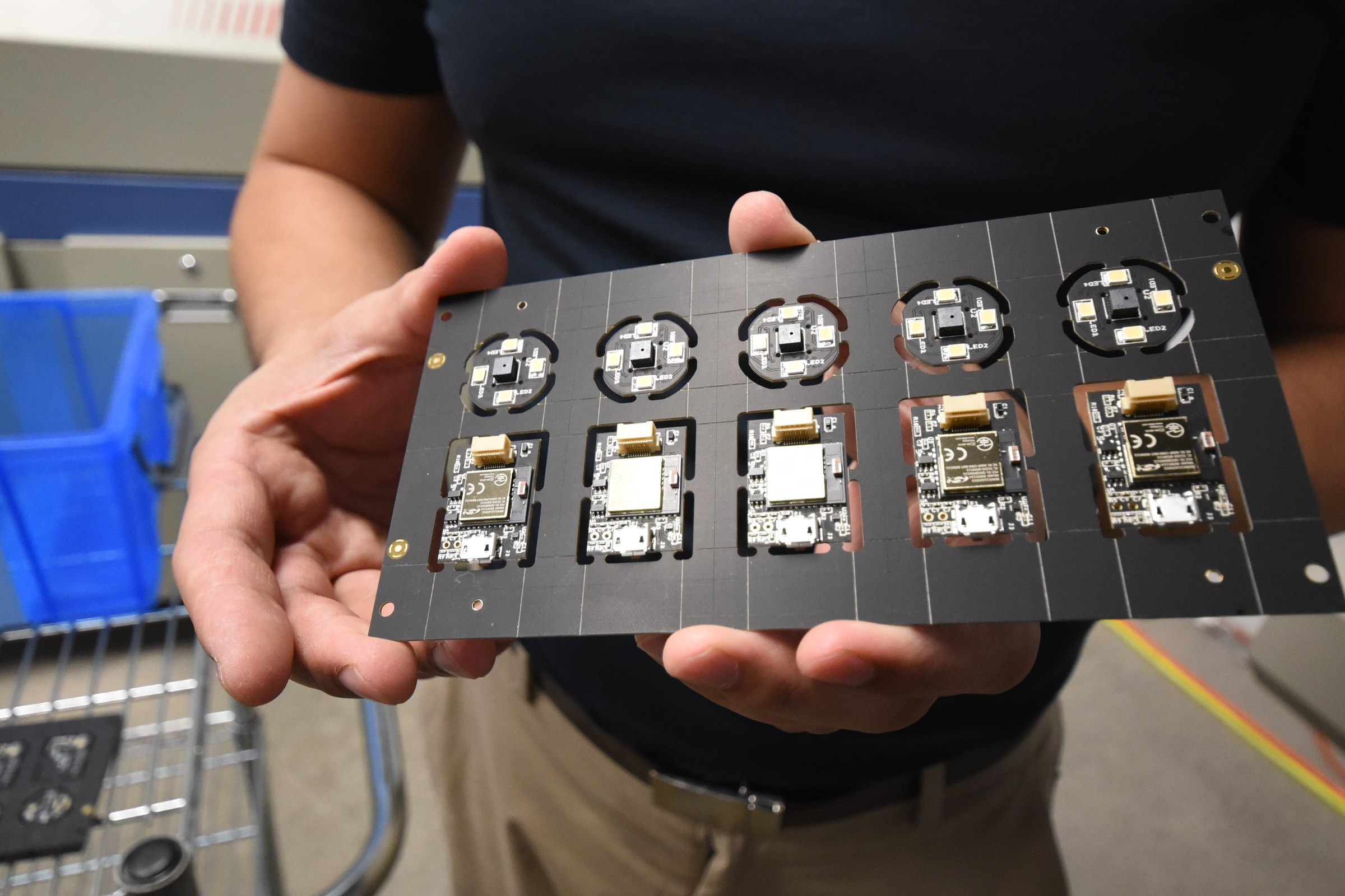 Dr. George Yu holds component board for Variable's Color Muse scanning device at the company's Chattanooga production site.
