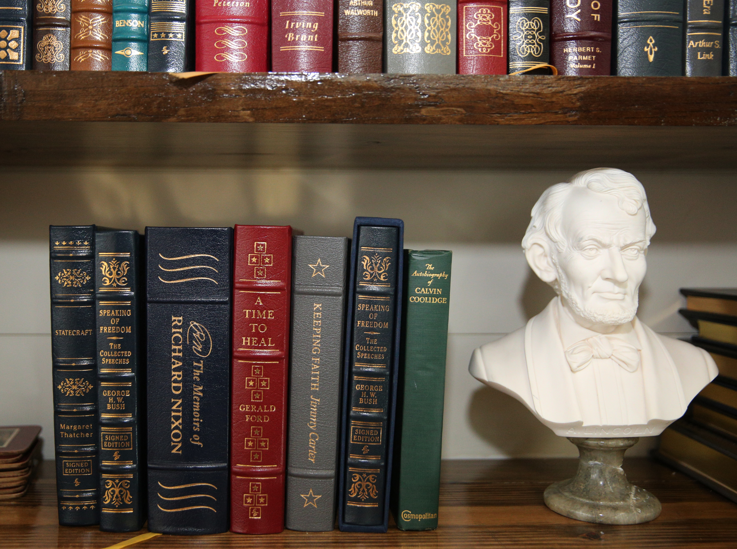 Several signed copies of books sit on the shelves at George Nelson's home Wednesday, Feb. 7, 2018 in Chattanooga, Tenn. Nelson is a collector of books and other documents signed by political and other well-known figures.