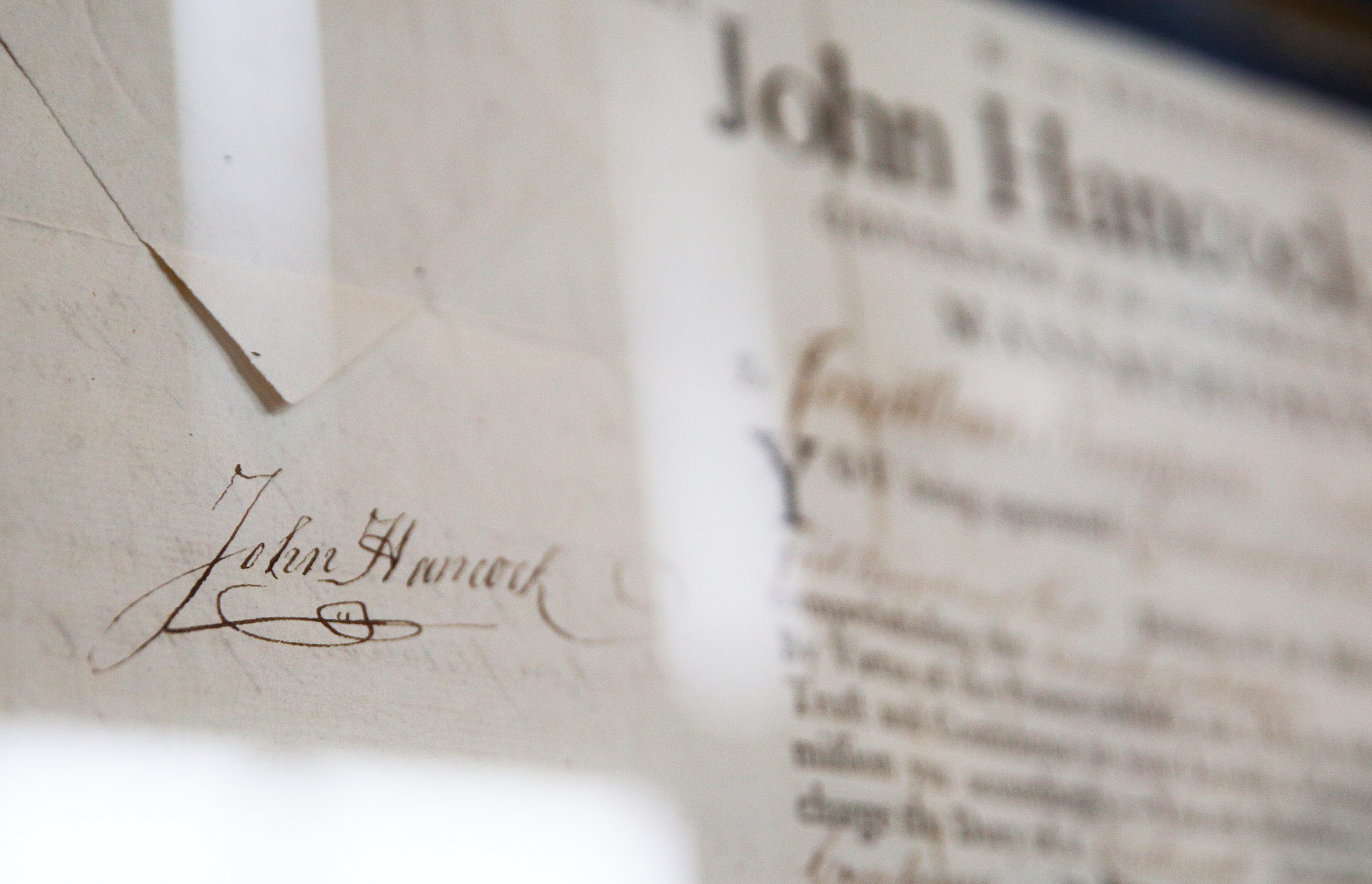 John Hancock's signature is on one of the documents decorating the walls at George Nelson's home Wednesday, Feb. 7, 2018 in Chattanooga, Tenn. Nelson collects documents and books signed by political and other well known historical figures.
