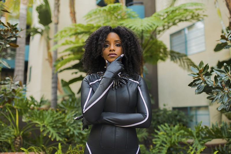 Portia Lewis wears a Black Panther-inspired costume in the courtyard of her apartment complex in Los Angeles, Jan. 30, 2018. Black Panther cosplayers aim to add diversity to an overwhelmingly white community. (Walter Thompson Hernandez/The New York Times) 