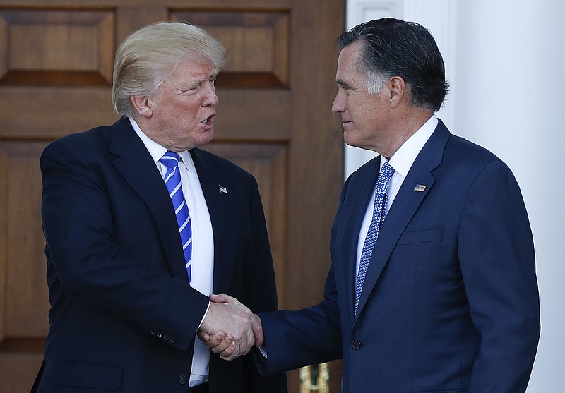 
              FILE - In this Nov. 19, 2016, file photo, President-elect Donald Trump and Mitt Romney shake hands as Romney leaves the Trump National Golf Club Bedminster in Bedminster, N.J.   Romney and Trump exchanged harsh criticisms of one another during the 2016 presidential campaign but also have a history of being willing to sit down with each other when mutually beneficial. Romney's announcement that he's running for the U.S. Senate seat in Utah creates the potential for future battles, or even deal-making. (AP Photo/Carolyn Kaster, File)
            