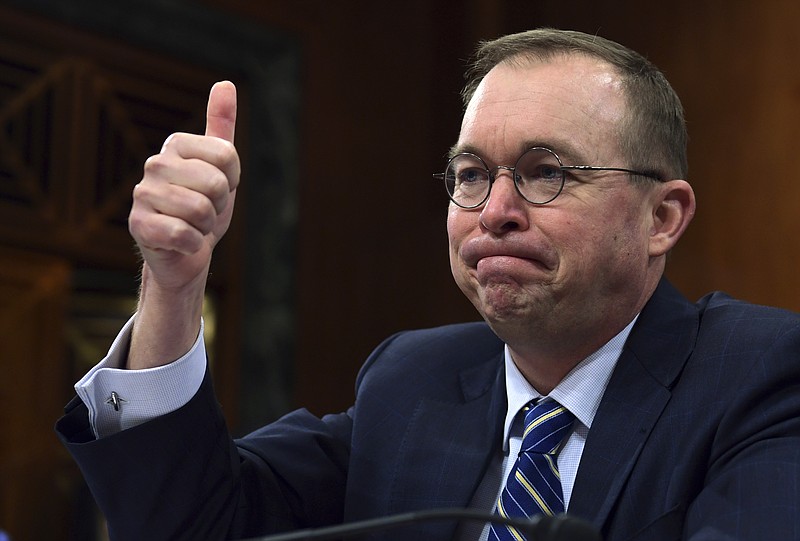 In this Feb. 13, 2018, photo, budget director Mick Mulvaney testifies before the Senate Budget Committee on Capitol Hill in Washington. The Trump administration is pushing a "bold new approach to nutrition assistance: " Replacing the traditional cash on a card that food stamp recipients currently get with a pre-assembled box of canned foods and other shelf-stable goods dubbed "America's Harvest Box." Mulvaney likened the box to a meal kit delivery service, and said the plan could save nearly $130 billion over ten years. The idea, tucked into President Donald Trump's 2019 budget, has caused a firestorm, prompting scathing criticism from Democrats and food insecurity experts who say its primary purpose is to punish the poor. (AP Photo/Susan Walsh)