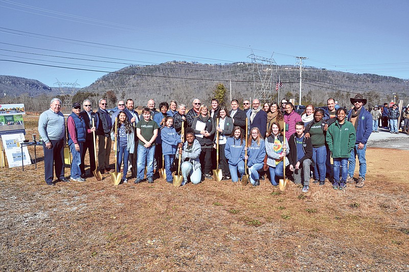 Ivy Academy Chattanooga students, staff, board members and administration, along with representatives from the city of Soddy-Daisy, the Tennessee Department of Environment and Conservation, United States Department of Agriculture, Dillard Construction and Franklin Architects, use gold shovels to break ground for the school's new academic buildings. (Contributed photo)