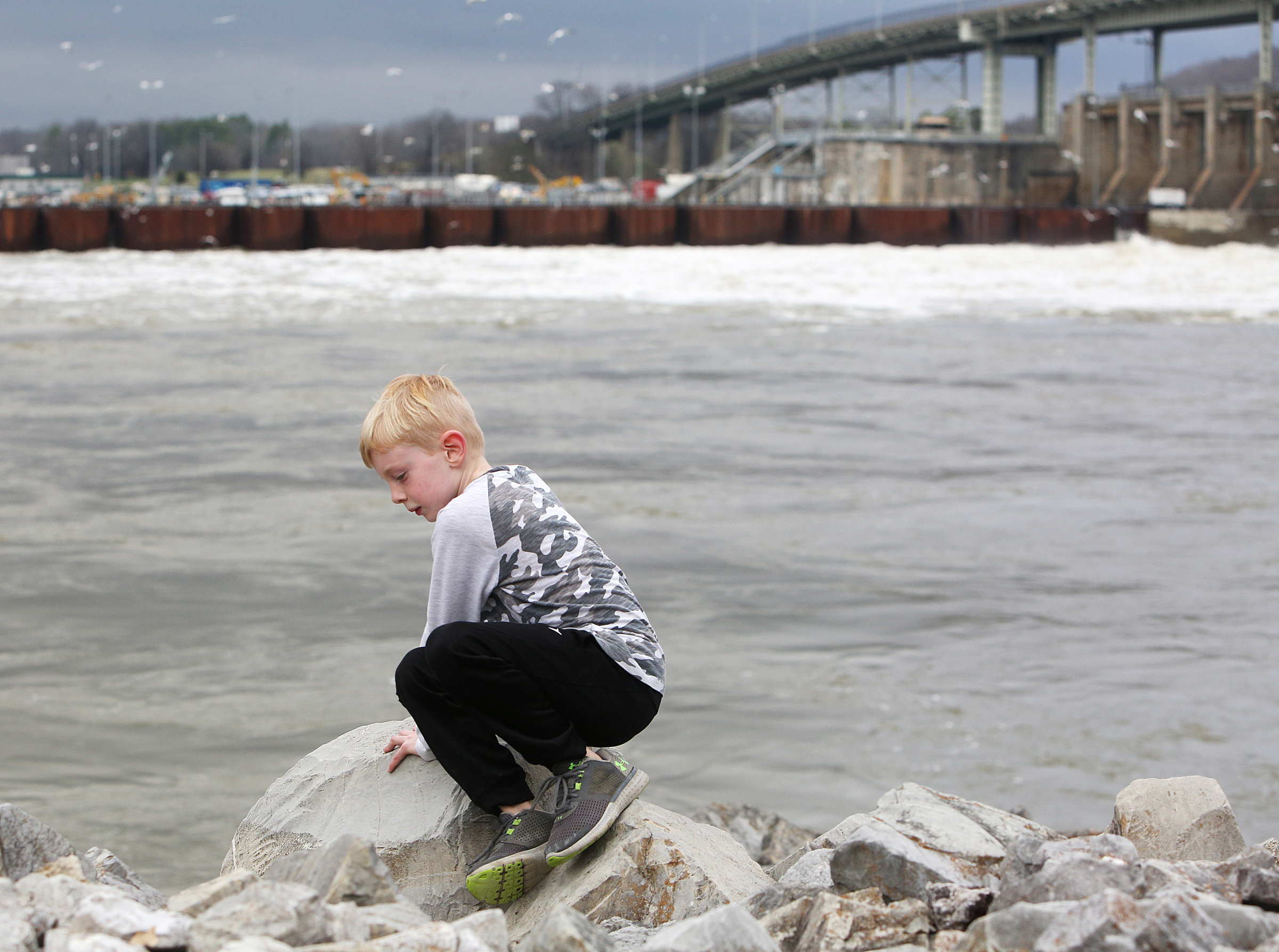 Jack Sokohl, 6, climbs on rocks Monday, Feb. 19, 2018 along the Chattanooga Riverwalk in Chattanooga, Tenn. Jack and his younger brother were visiting the park with their grandparents Monday, exploring the rocks and geology in the area.