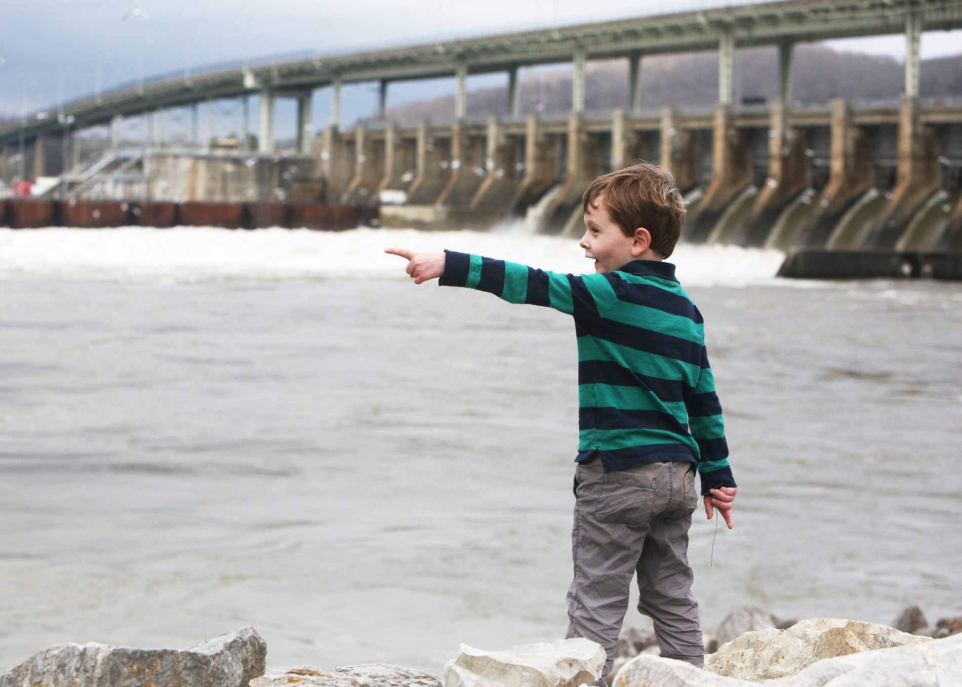 Ben Sokohl, 4, points to a train while checking out rocks Monday, Feb. 19, 2018 along the Chattanooga Riverwalk by the Chickamauga Dam in Chattanooga, Tenn. Ben and his older brother were visiting the park with their grandparents Monday, exploring the rocks and geology in the area.
