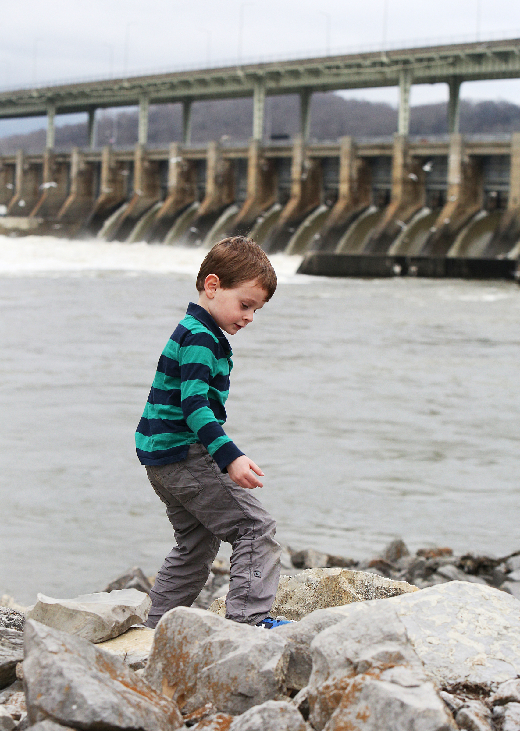 Ben Sokohl, 4, checks out rocks Monday, Feb. 19, 2018 along the Chattanooga Riverwalk by the Chickamauga Dam in Chattanooga, Tenn. Ben and his older brother were visiting the park with their grandparents Monday, exploring the rocks and geology in the area.