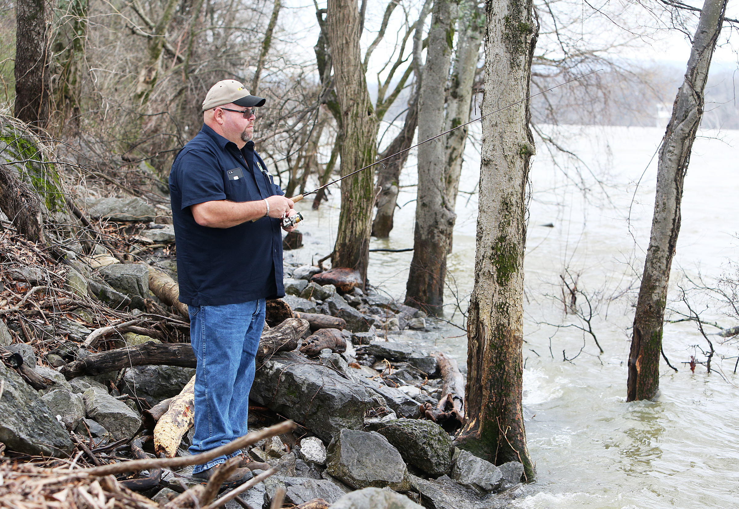 Scott Wheeler fishes from the shores along the Chattanooga Riverwalk Monday, Feb. 19, 2018 in Chattanooga, Tenn. Wheeler said it was the first time this season he was able to get out and fish. He had a few minutes to spare after getting out of a doctor's appointment earlier than expected, and the weather was too nice to not spend a little time at the river.