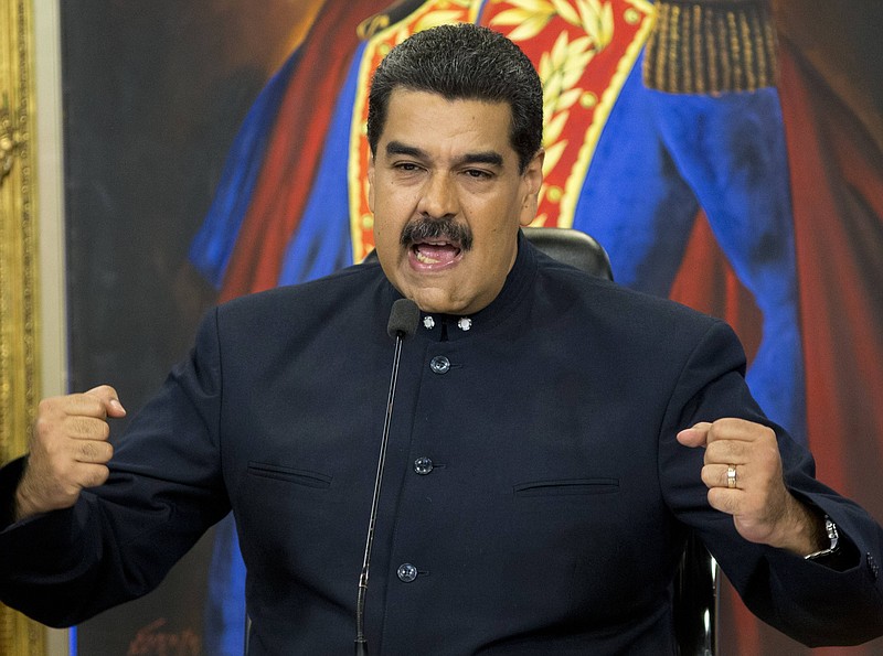 In this Oct. 17, 2017 file photo, Venezuela's President Nicolas Maduro speaks during a press conference at the Miraflores presidential palace, in Caracas, Venezuela. Maduro told international journalists Thursday, Feb. 15, 2018, he isn't above crashing a party after his invitation was yanked to the Summit of the Americas, a meeting of regional leaders set for April in Peru. (AP Photo/Ariana Cubillos, File)