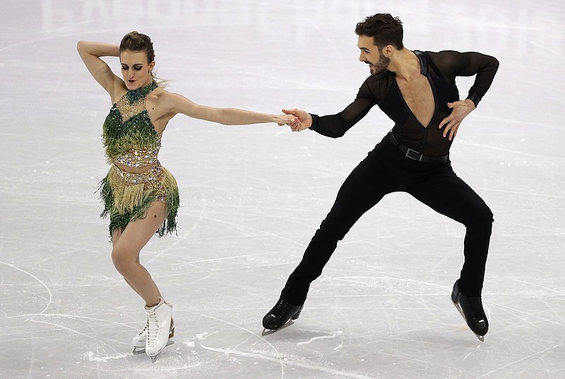 Gabriella Papadakis and Guillaume Cizeron of France perform during the ice dance, short dance figure skating in the Gangneung Ice Arena at the 2018 Winter Olympics in Gangneung, South Korea, Monday, Feb. 19, 2018. (AP Photo/David J. Phillip)