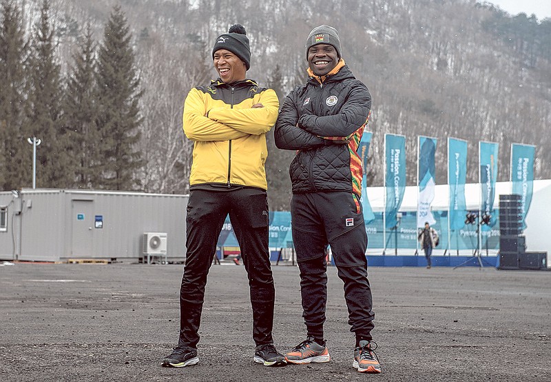 From left, Anthony Watson, who represents Jamaica in skeleton, and Akwasi Frimpong, who represents Ghana, in Pyonchang, South Korea, on Wednesday, Feb. 14, 2018. Watson and Frimpong met at a training camp for what are called emerging countries in the sport and became fast friends. (Hilary Swift/The New York Times)  