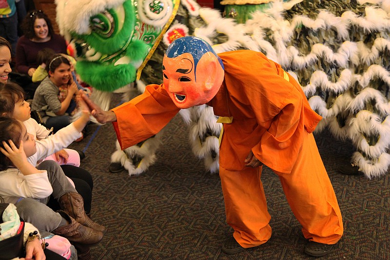 Characters in Chinese costumes meet children at a previous Chinese New Year celebration. (Contributed Photo)