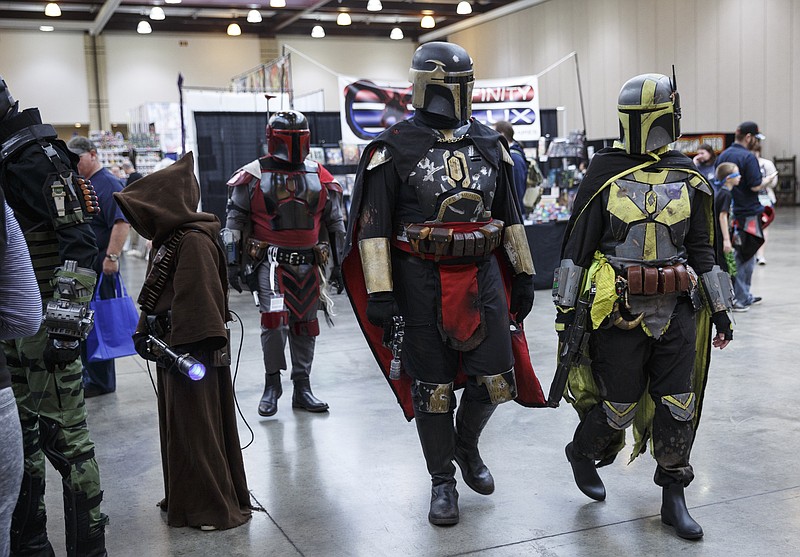 Con Nooga visitors cosplay as Mandalorians from the Star Wars series at the 2017 convention in the Chattanooga Convention Center.