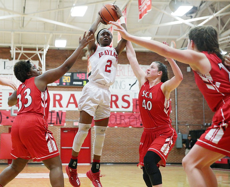 Baylor's Jutoreyia Willis (2) puts up a shot while being guarded by St. Cecilia's Jayla Ridley (33) and Gracey Gallagher (40) during the Baylor vs. St. Cecilia girls' basketball game Tuesday, Feb. 20, 2018 at Baylor School in Chattanooga, Tenn.