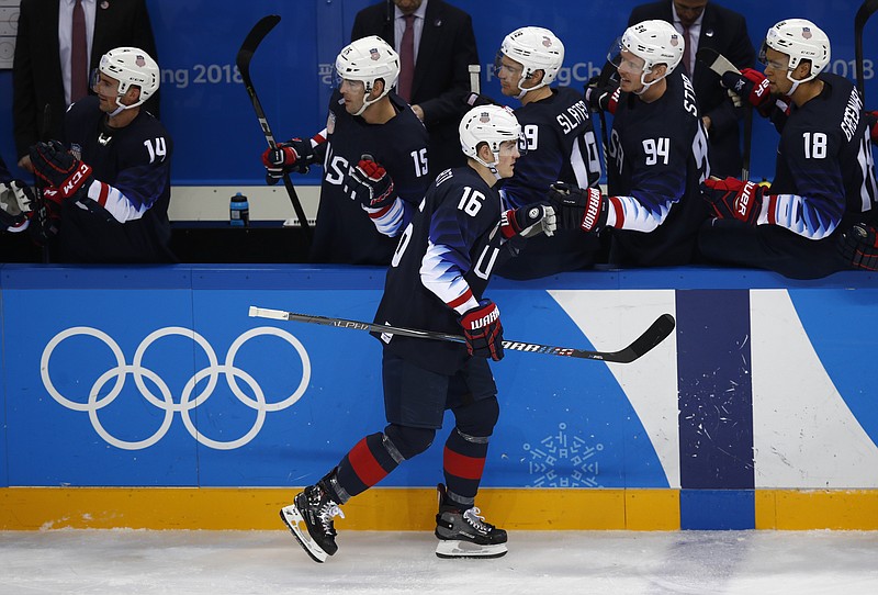 Ryan Donato (16), of the United States, celebrates his teammates after scoring a goal against Slovakia during the second period of the qualification round of the men's hockey game at the 2018 Winter Olympics in Gangneung, South Korea, Tuesday, Feb. 20, 2018. (AP Photo/Jae C. Hong)