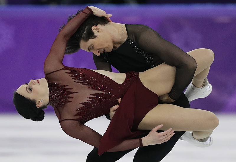 Tessa Virtue and Scott Moir of Canada perform during the ice dance, free dance figure skating final in the Gangneung Ice Arena at the 2018 Winter Olympics in Gangneung, South Korea, Tuesday, Feb. 20, 2018. (AP Photo/David J. Phillip)