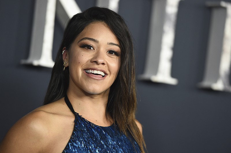 
              FILE - In a Tuesday, Feb. 13, 2018 file photo, actress Gina Rodriguez arrives at the Los Angeles premiere of "Annihilation" at the Regency Village Theatre. Rodriguez is set to host the 20th Costume Designers Guild Awards Tuesday night, Feb. 20, 2018,  at the Beverly Hilton Hotel in Beverly Hills, California.(Photo by Jordan Strauss/Invision/AP)
            