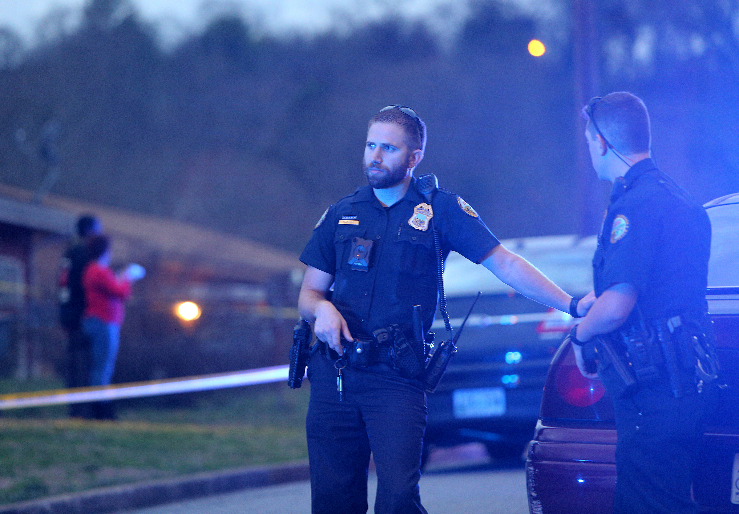 Chattanooga police officers work the scene of a shooting Tuesday, Feb. 20, 2018 in the 1400 block of Carousel Road in Chattanooga, Tenn. One person is deceased following the incident and another is in critical condition.