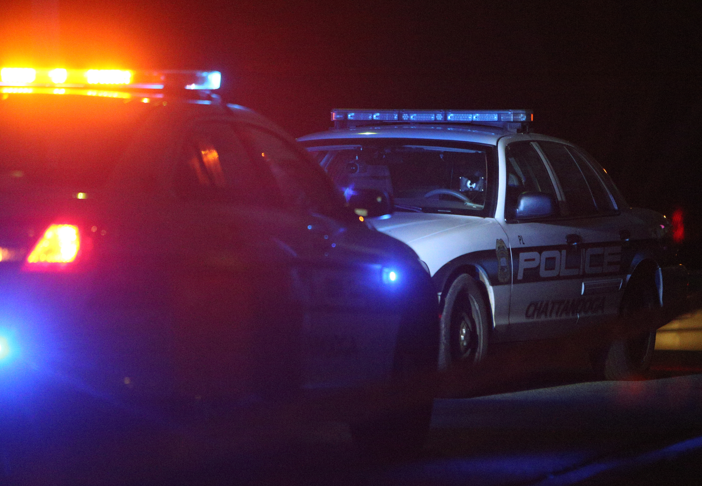 Chattanooga police officers work the scene of a shooting Tuesday, Feb. 20, 2018 in the 1400 block of Carousel Road in Chattanooga, Tenn. One person is deceased following the incident and another is in critical condition.