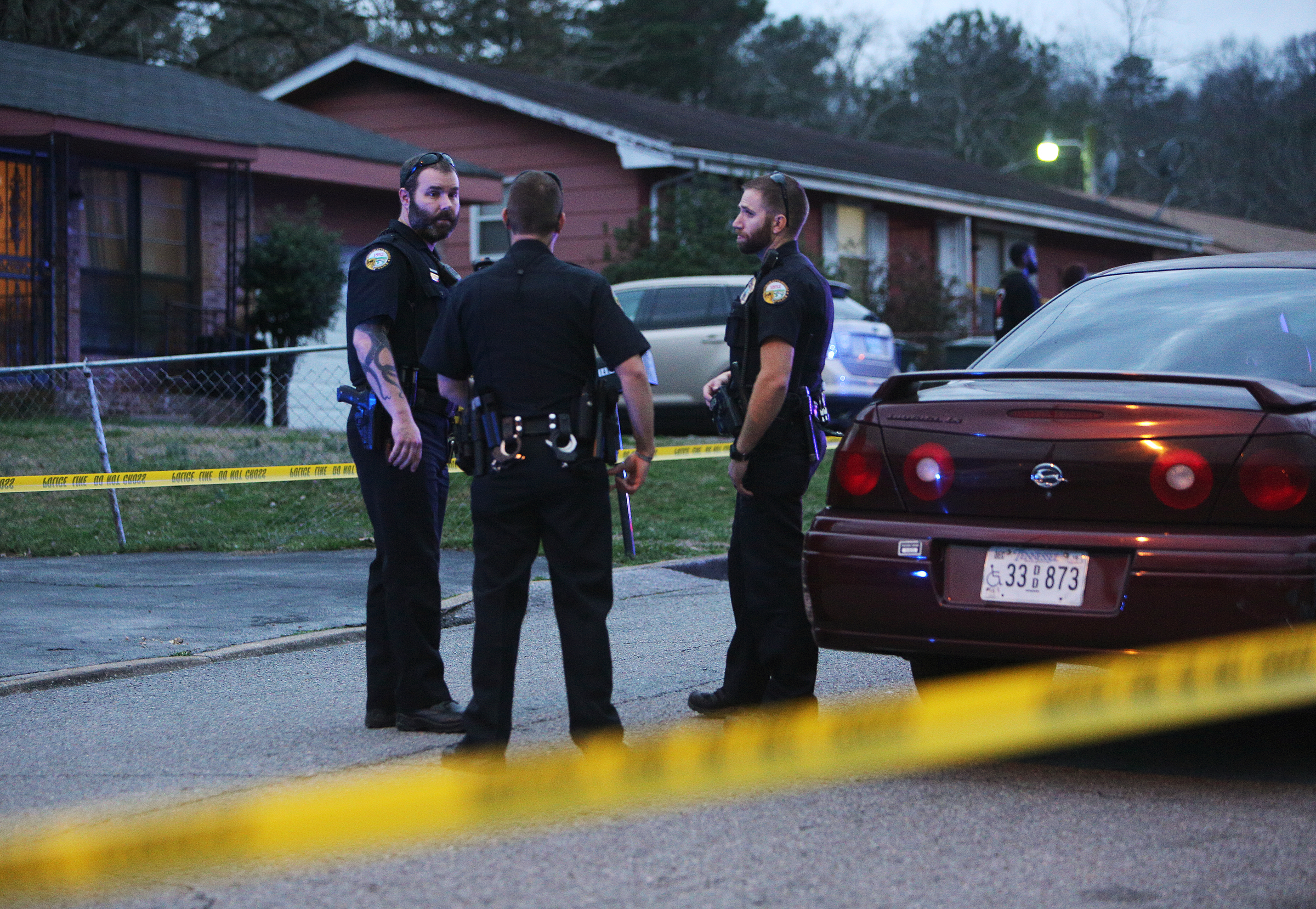 Chattanooga police officers work the scene of a shooting Tuesday, Feb. 20, 2018 in the 1400 block of Carousel Road in Chattanooga, Tenn. One person is deceased following the incident and another is in critical condition.