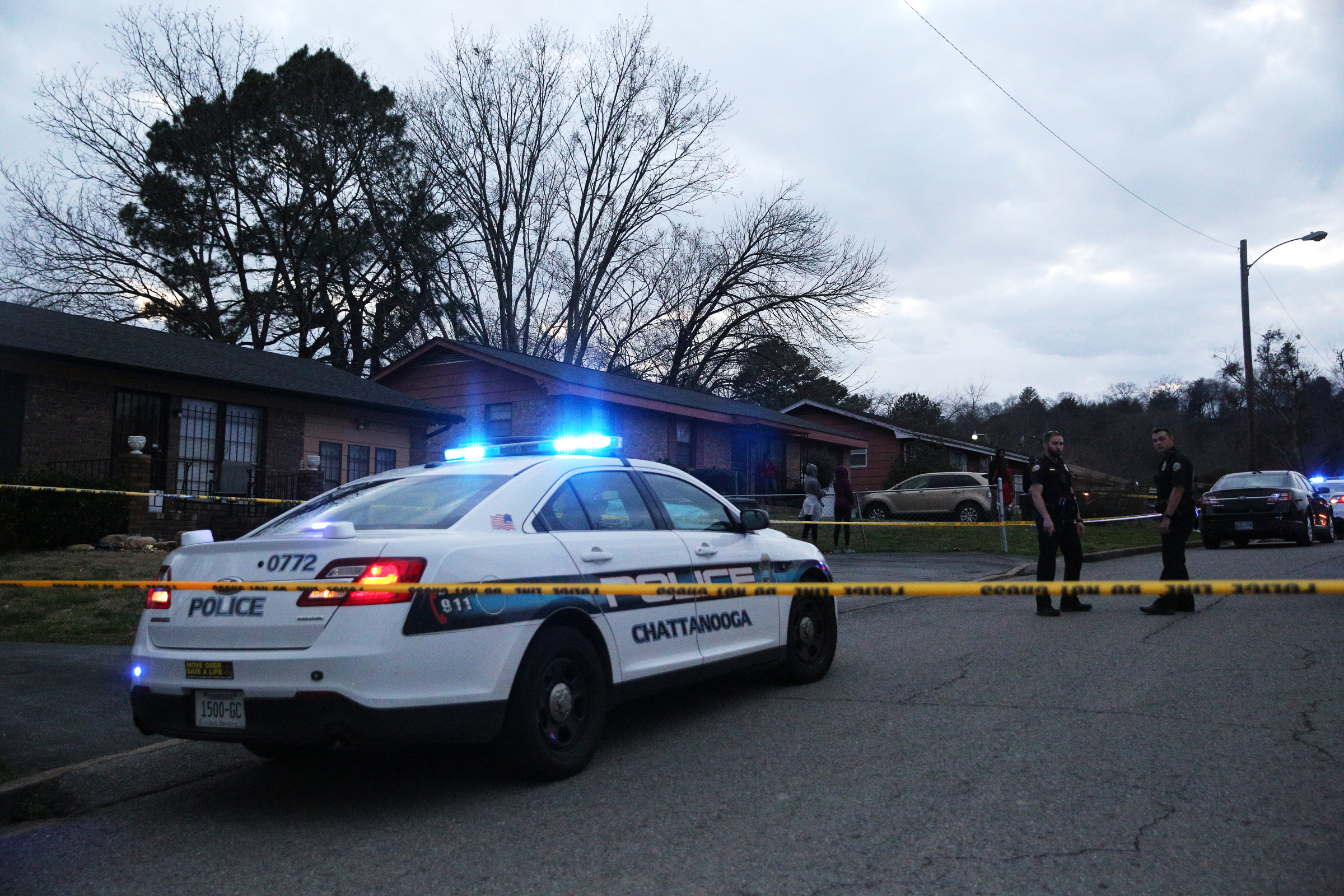 Chattanooga police officers work the scene of a shooting Tuesday, Feb. 20, 2018 in the 1400 block of Carousel Road in Chattanooga, Tenn. One person is deceased following the incident and another is in critical condition.
