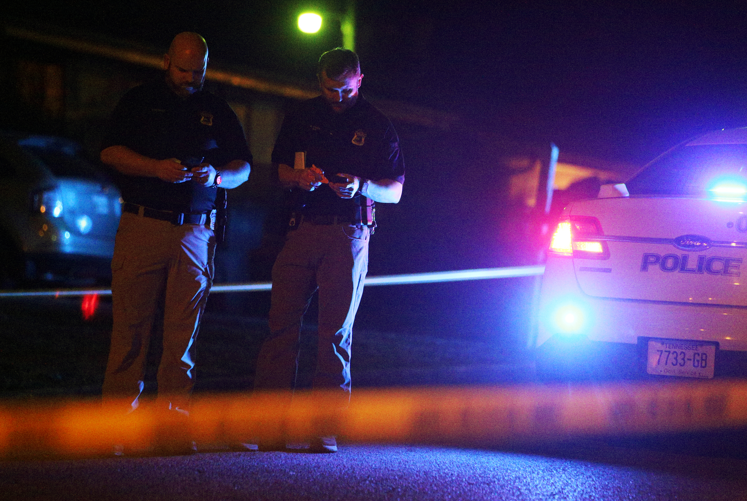 Chattanooga police officers work the scene of a shooting Tuesday, Feb. 20, 2018 in the 1400 block of Carousel Road in Chattanooga, Tenn. One person is deceased following the incident and another is in critical condition.