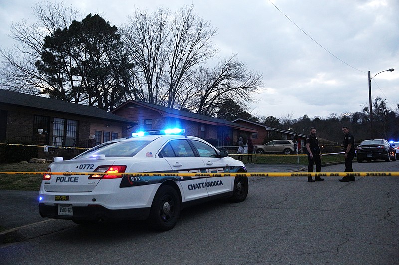 Chattanooga police officers work the scene of a shooting Tuesday, Feb. 20, 2018 in the 1400 block of Carousel Road in Chattanooga, Tenn. One person is deceased following the incident and another is in critical condition. 