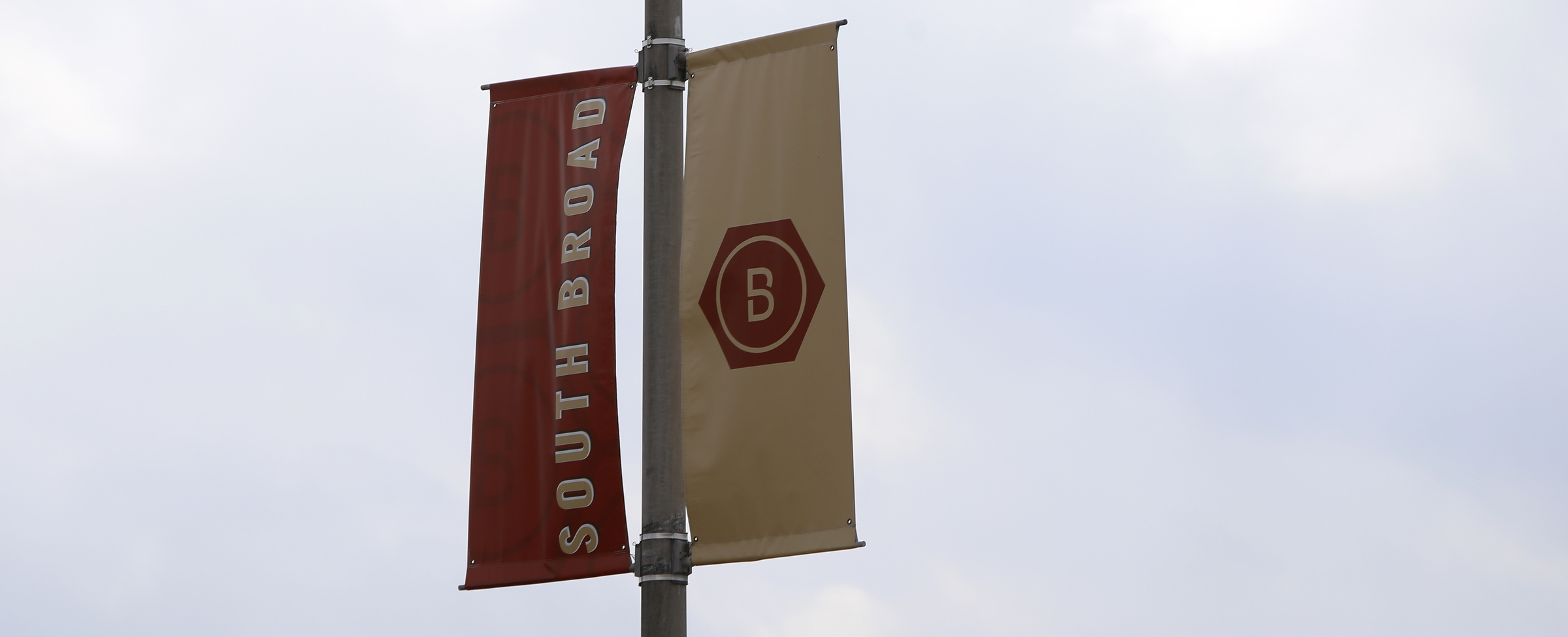 Signage is seen on a light pole along South Broad Street in the South Broad Street District on Tuesday, Feb. 20, 2018 in Chattanooga, Tenn.