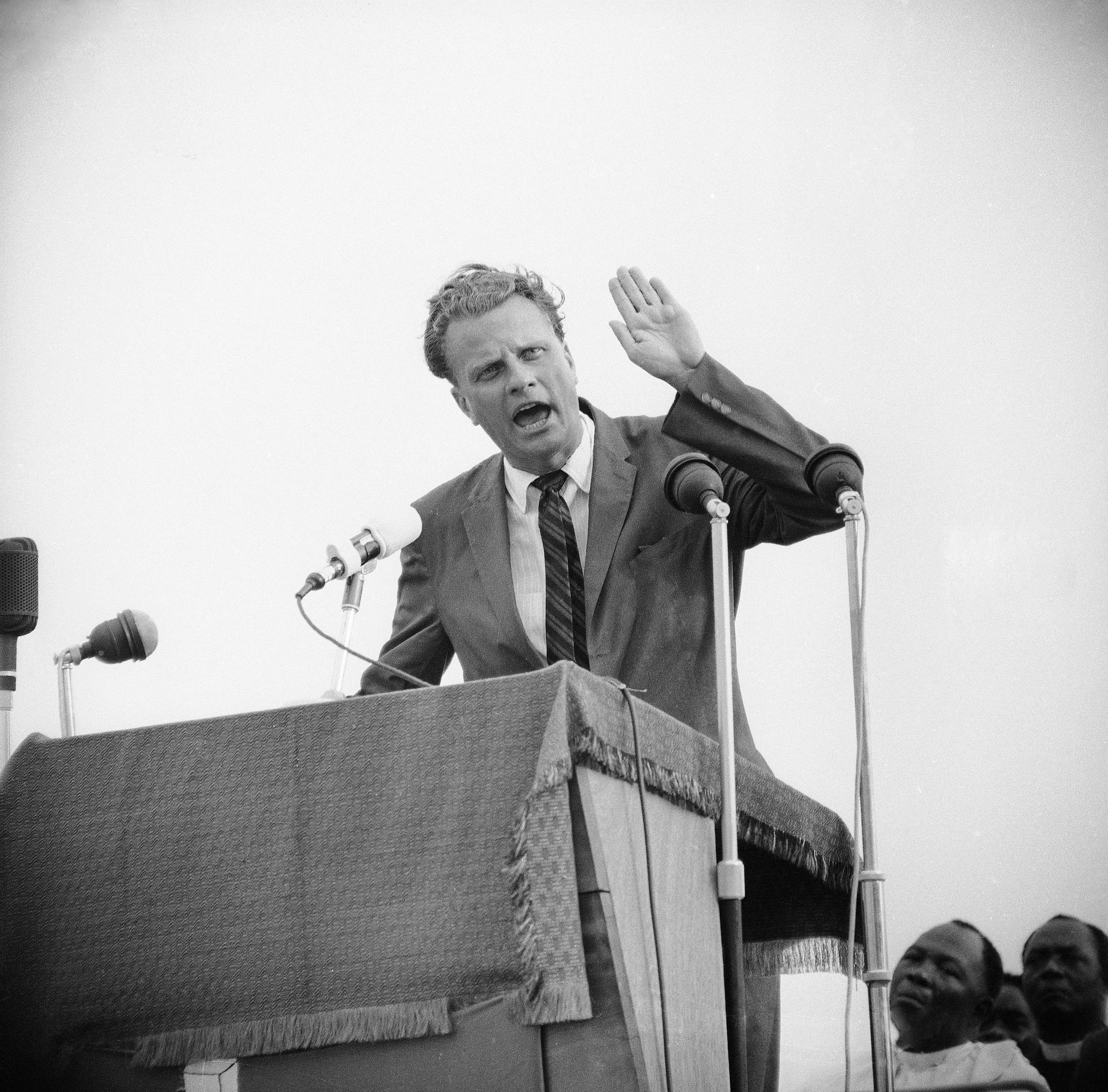 Evangelist Billy Graham at his first meeting at the Sports Stadium in Accra, Ghana, Jan. 24, 1960. (AP Photo/Royale)