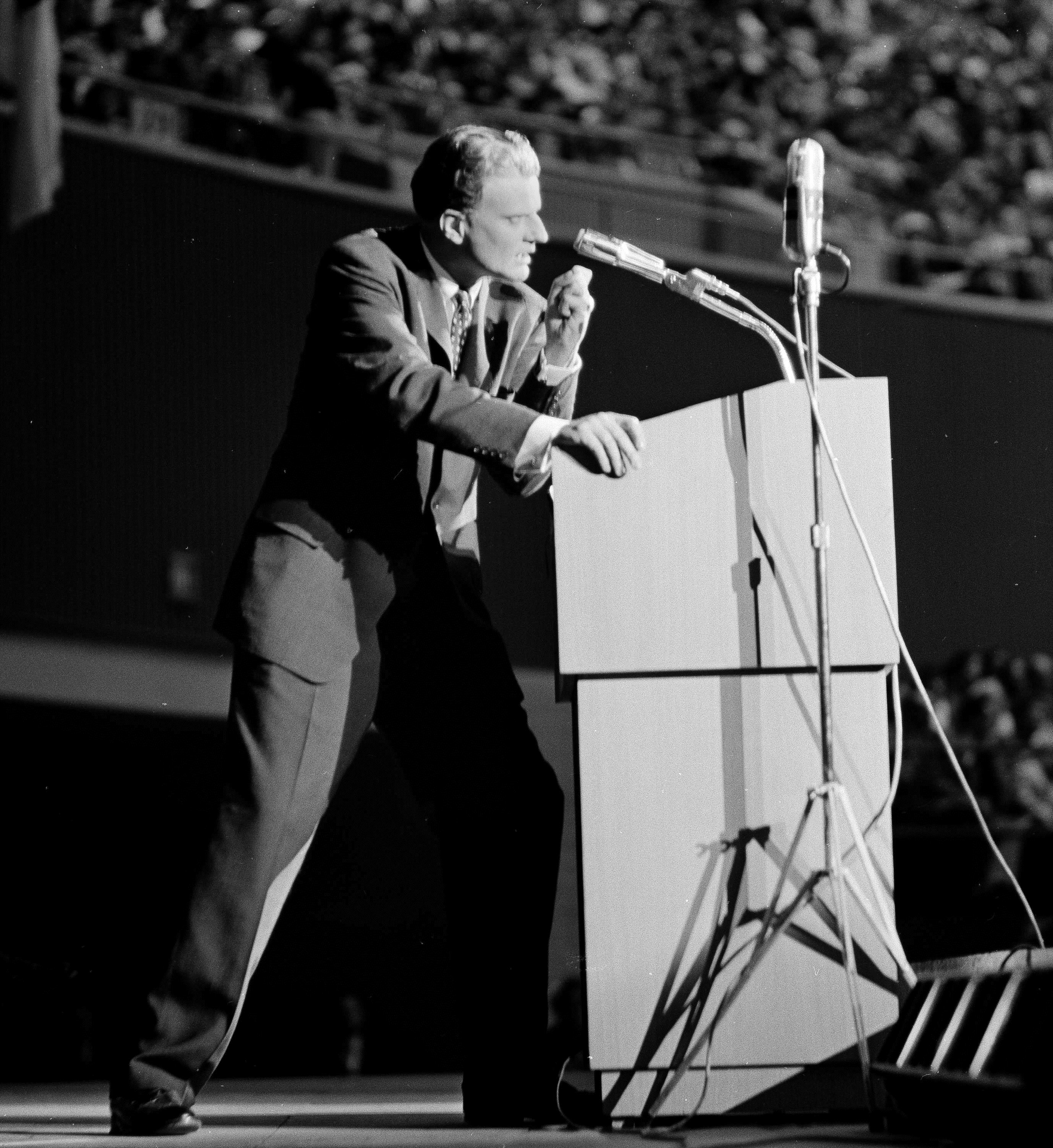 Evangelist Billy Graham speaks passionately before the combined Texas Baptist World Mission and State Evangelistic Conference in Dallas, Jan. 11, 1959. Graham cancelled an earlier sermon at the First Baptist Church and was ordered to enter the Mayo Clinic in Rochester, Minnesota. (AP Photo/Ferd Kaufman)