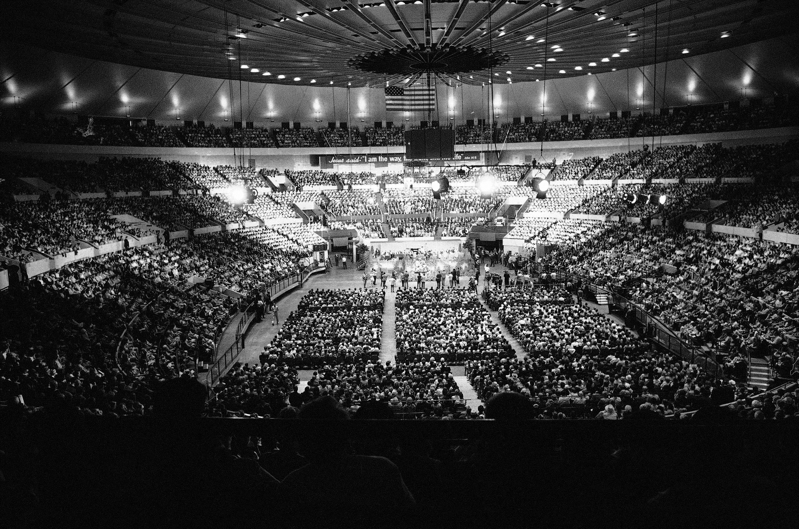 Huge crowd is assembled in New Yorks Madison Square Garden June 13, 1969 at the opening of a 10-day crusade by Evangelist Billy Graham. More than 20,000 persons packed the arena. Speakers platform is in the center of the picture. (AP Photo)