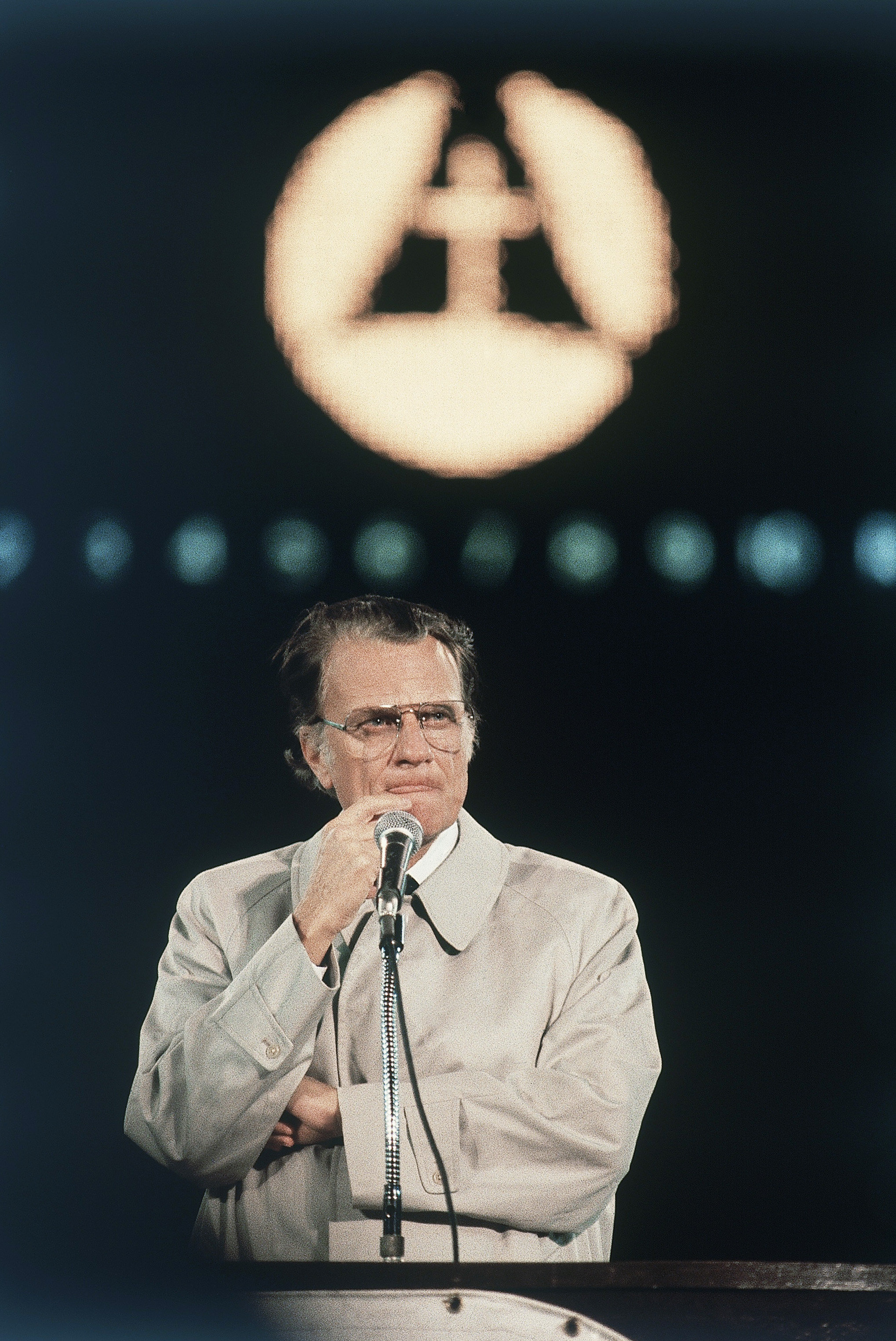 American evangelist Billy Graham shown speaking in Tokyo on a six-city Evangelistic tour of Japan in which he delivered the Christian message in this predominantly Buddhist Nation. He spoke to a capacity crowd of 43,000 at Korakuen Stadium on Oct. 1980. (AP Photo)