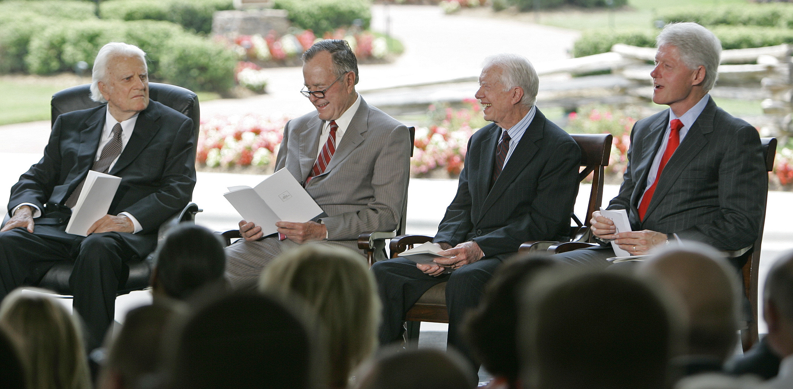 Billy Graham, from left, sits with former Presidents George H.W. Bush, Jimmy Carter and Bill Clinton during a dedication ceremony for the Billy Graham Library in Charlotte, N.C., Thursday, May 31, 2007. (AP Photo/Gerry Broome)