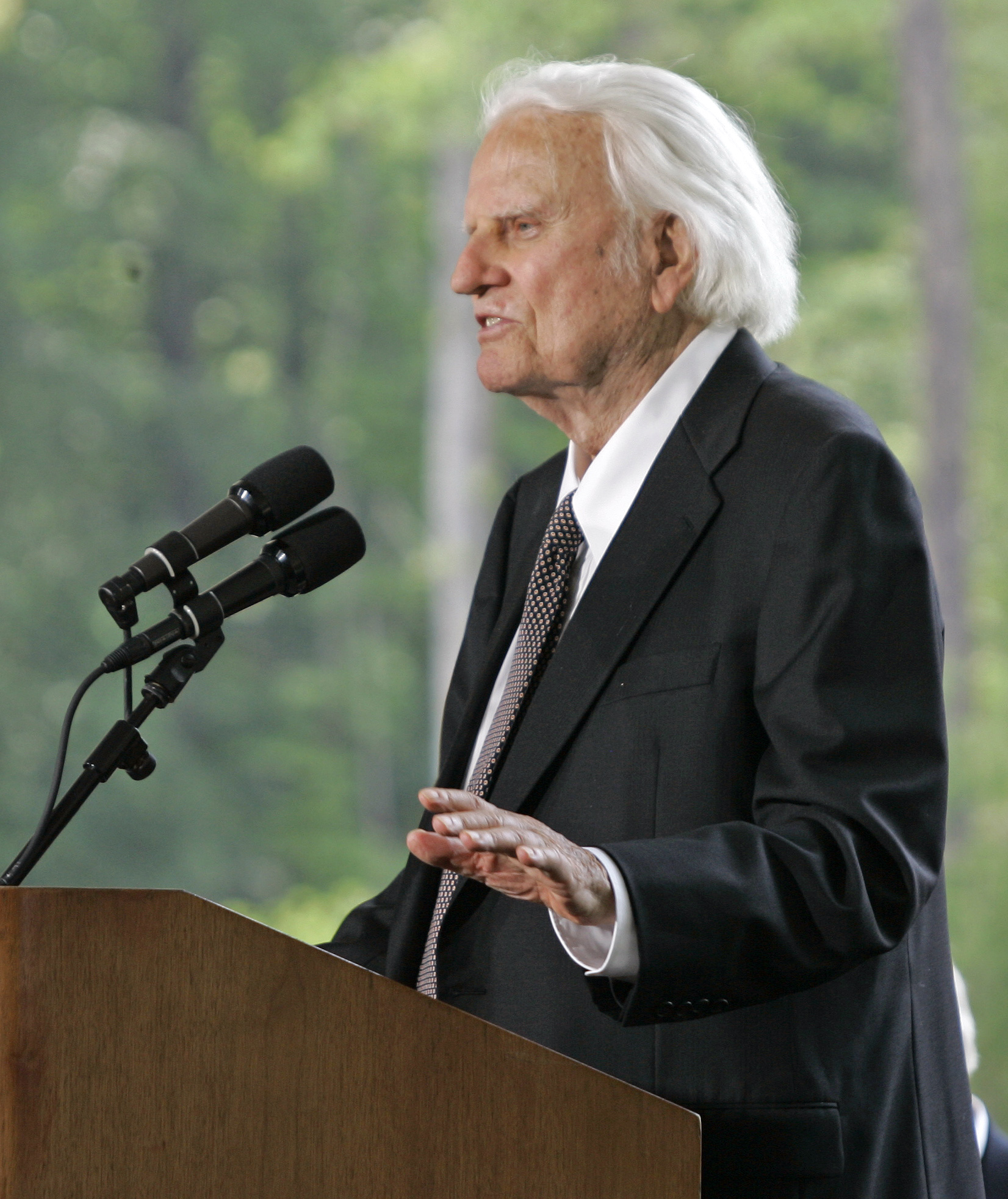 **FILE** Evangelist Billy Graham addresses the crowd during the dedication for the Billy Graham Library in Charlotte, N.C., in this 2007, file photo. Graham underwent successful surgery Wednesday, Feb. 13, 2008, to update a shunt that controls excess fluid in his brain, and was expected to remain in the hospital for several days. (AP Photo/Chuck Burton, File)
