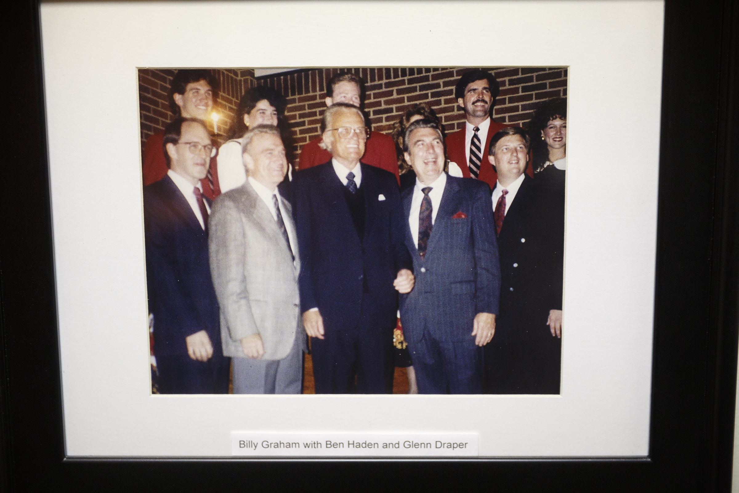 A photo of Dr. Glenn Draper with Billy Graham hangs in his office on Tuesday, Aug. 23, 2016, in Chattanooga, Tenn.