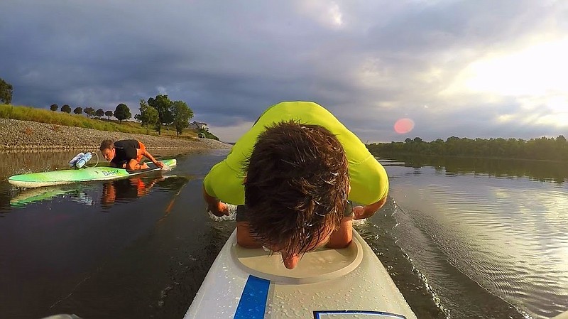 Britt Reynolds prone paddles the Tennessee River.