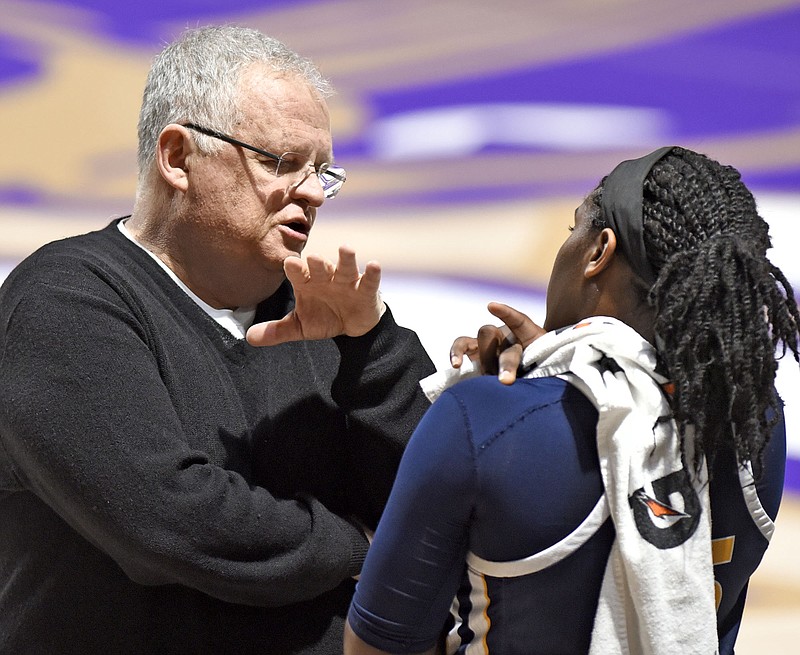 Chattanooga head coach Jim Foster instructs Aryanna Gilbert (35) during a timeout.  The University of Tennessee Mocs visited the Western Carolina Catamounts in Southern Conference women's basketball action at the Ramsey Center in Cullowhee, North Carolina on February 1, 2018