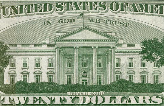 Enlargement of a portion of a 20-dollar bill showing the "In God We Trust" motto. (Themanwithoutapast at English Wikipedia [Public domain], via Wikimedia Commons)