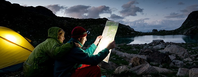 couple tent camping in the wilderness